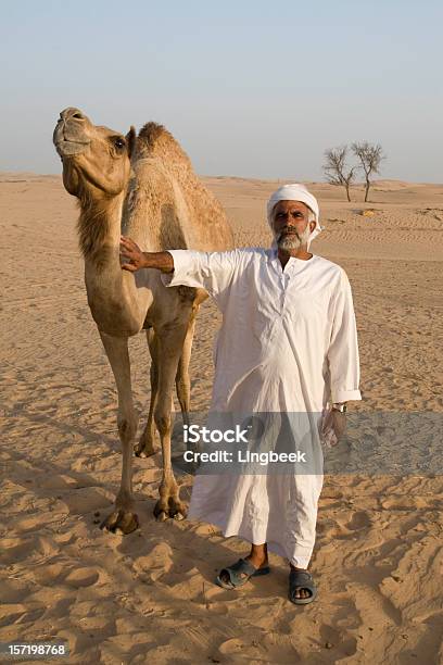 Arabische Mann Mit Kamel Stockfoto und mehr Bilder von Kamel - Kamel, Nahaufnahme, Vertikal