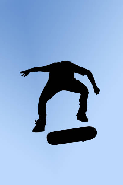 スケートボードジャンプ - extreme skateboarding action balance motion ストックフォトと画像