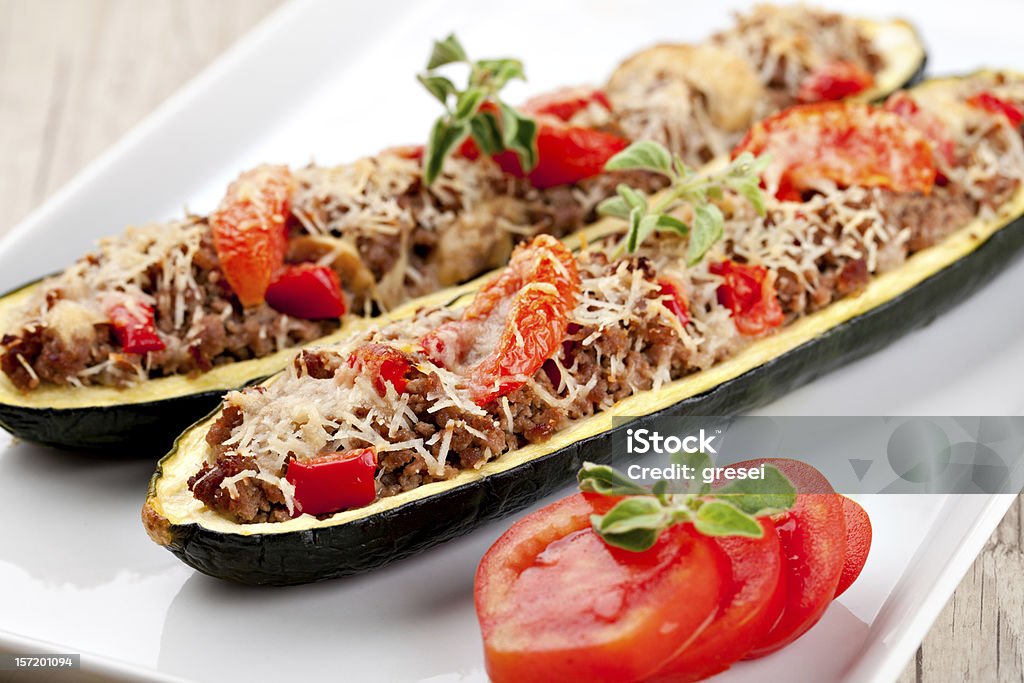 Zucchini halves stuffed with minced meat Zucchini halves stuffed with minced meat and vegetable Baked Stock Photo