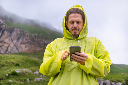 One solo traveler having a hiking adventure with his tour guide somewhere in the mountains