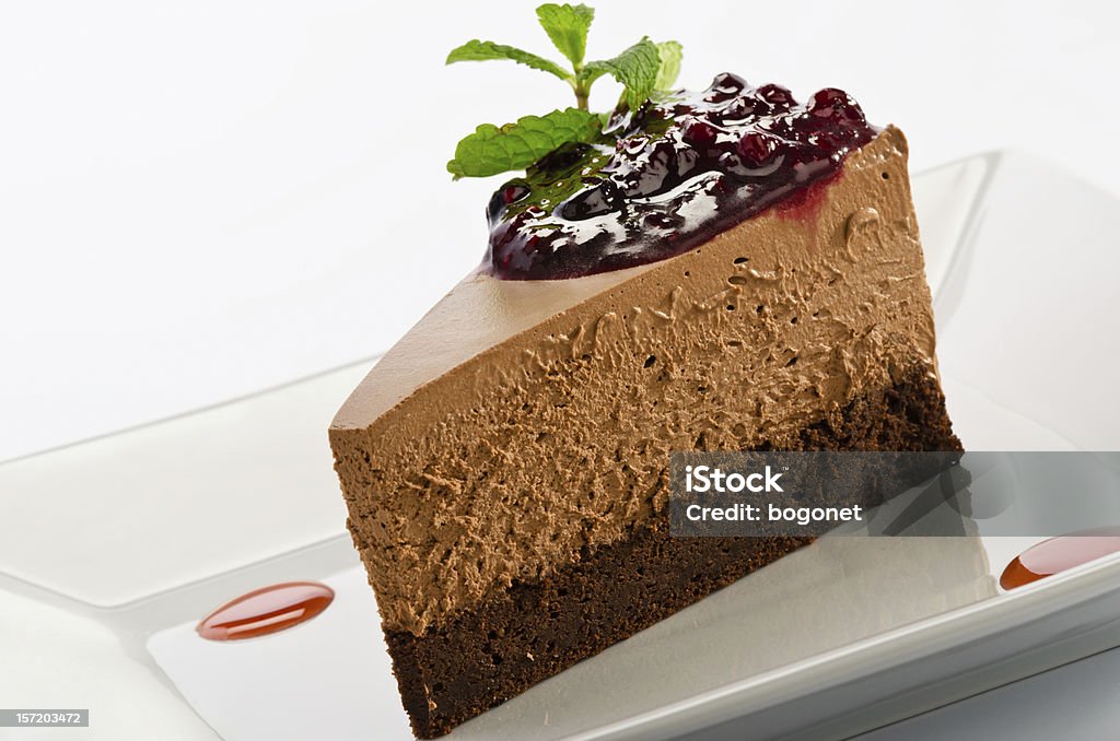 Chocolate layered mousse cake with dark cherries Baked Pastry Item Stock Photo