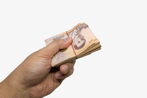 istock hand hold THB cash bundles, money stacks 1572040183