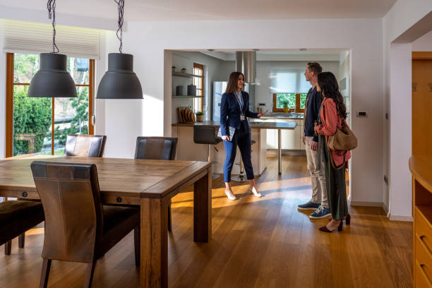 Estate agent talking with couple