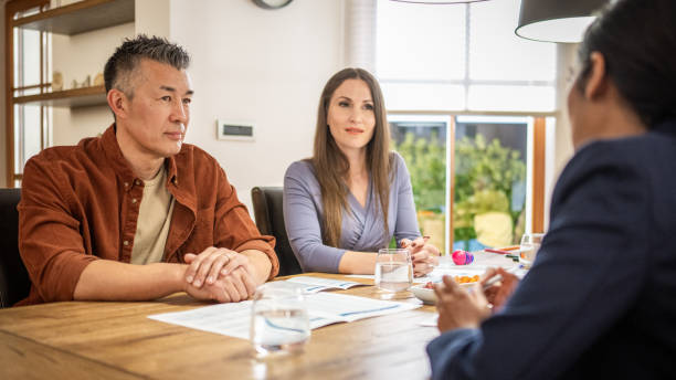 Couple talking with financial advisor
