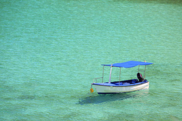 on turquoise Mediterranean sea with rippled clear water in summer sunshine