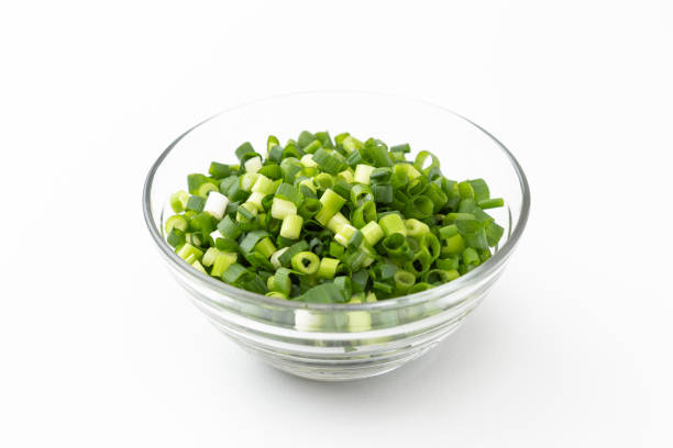 istock Chopped green onions on a white background. 1572081773