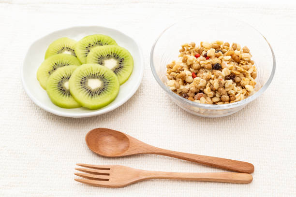 istock Breakfast of granola and kiwifruit. 1572084494