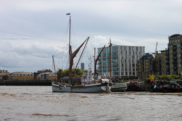 boats is docked in a river in a city