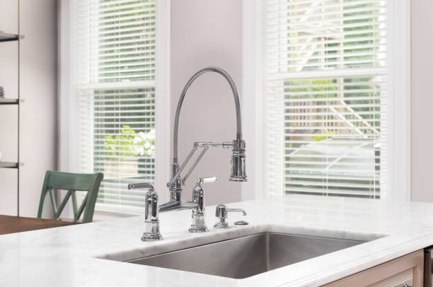 istock A kitchen sink and chrome faucet detail. 1572115075