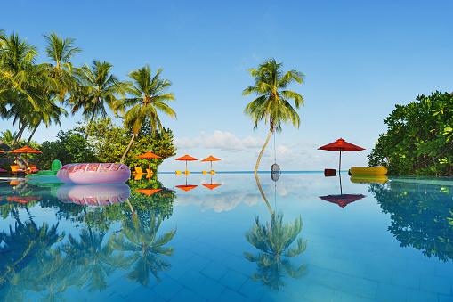 Swimming pool. Having fun on vacation at the hotel pool. Colorful vacation concept.