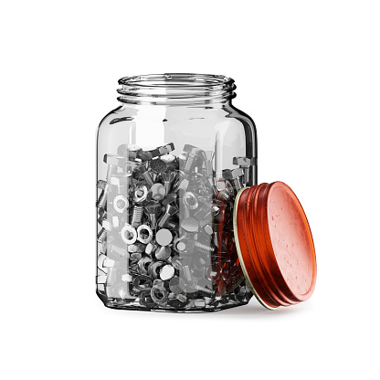 Mason jar with red lid full of screws bolts and nuts
