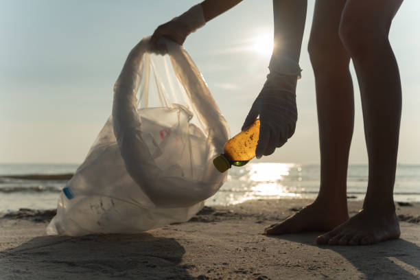 istock Save water. Volunteer pick up trash garbage at the beach and plastic bottles are difficult decompose prevent harm aquatic life. Earth, Environment, Greening planet, reduce global warming, Save world 1572139242