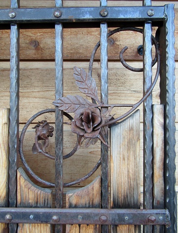 Metal fence decorated with wrought-iron decorative roses. Leavenworth, WA, USA