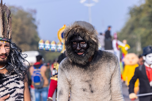 Bikaner, Rajasthan, India - January 2023: Camel festival, Portrait of an male artist with painted face and fantasy look  in historical character while participating in camel festival parade at bikaner. Selective focus.