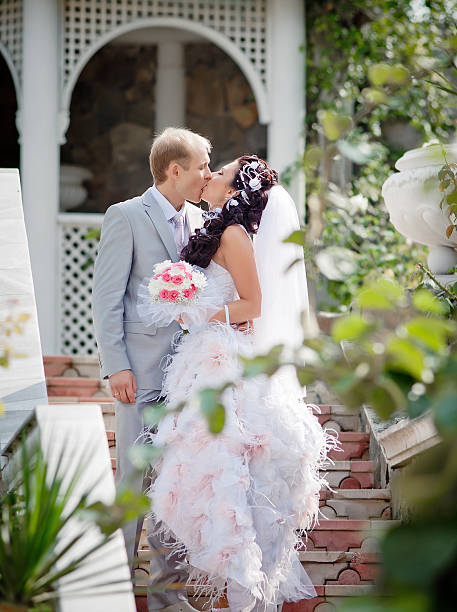 istock Newly wedded couple in the park 157218868