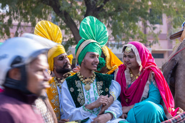 Male sikh artist performing bhangra dance stock photo