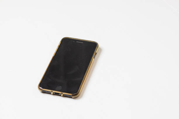 Old phone with cracked protective glass. Isolated on white background.