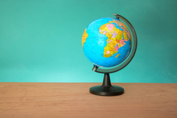 istock World globe isolated on a green background. Copy space.Earth day or environment conservation concept. Save green planet concept 1572248634