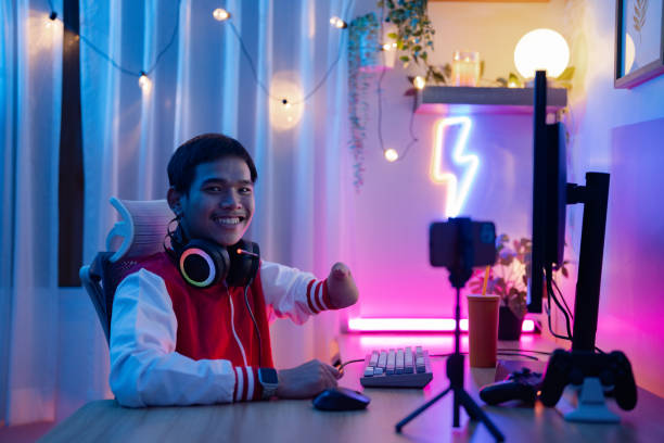 istock Disability eSports player plays online games. 1572262523