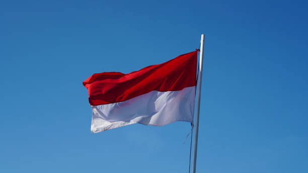 istock Indonesian red and white flag in the sky 1572267353