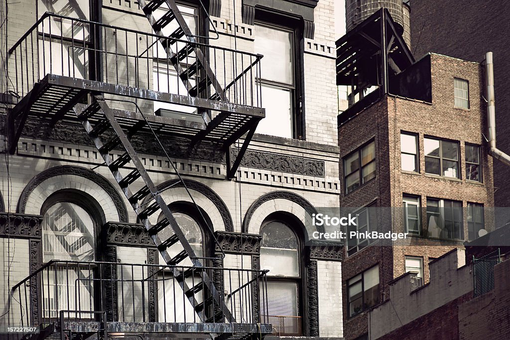 Metal fire escape Metal fire escape on facade of old building in New York City Balcony Stock Photo