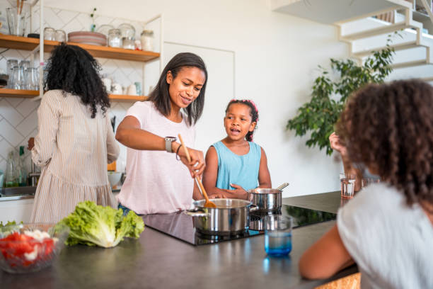 istock Joyful Multiracial Family Cooking Dinner 1572294273