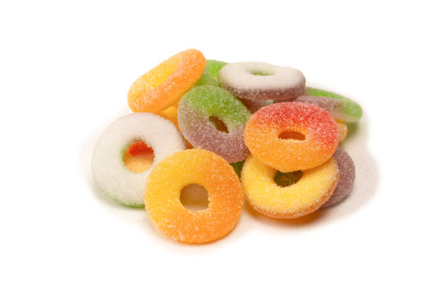 istock Assorted gummy candies isolated on a white background. Top view. 1572308434