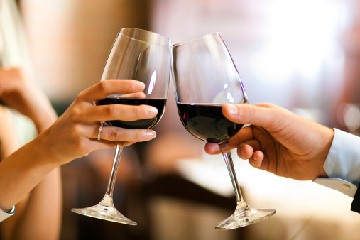 Couple toasting wine glasses