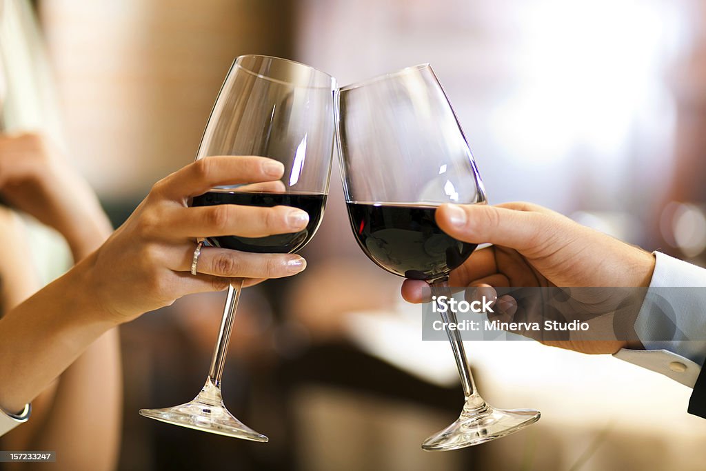 Couple toasting wine glasses Couple toasting wine glasses in an elegant restaurant Wine Stock Photo