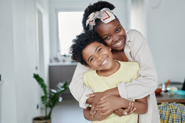 istock Happy mom embracing her little son 1572361778