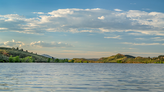 summer scenery of Horsetooth Reservoir in Colorado with some distant boats