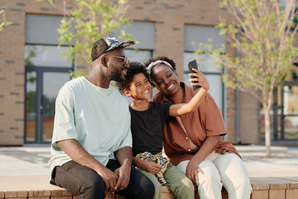 istock Family making selfie portrait on smartphone 1572362321