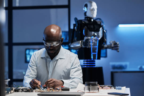 istock Engineer working with motherboard of robot 1572366089