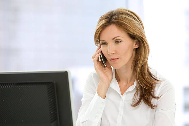 istock Executive Woman on the phone at workplace 157237906