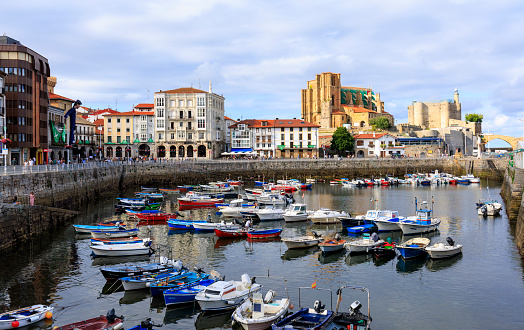 Castro Urdiales, Cantabria, Spain, July 11, 2023.\nPort with the castle-lighthouse and the church in the background.