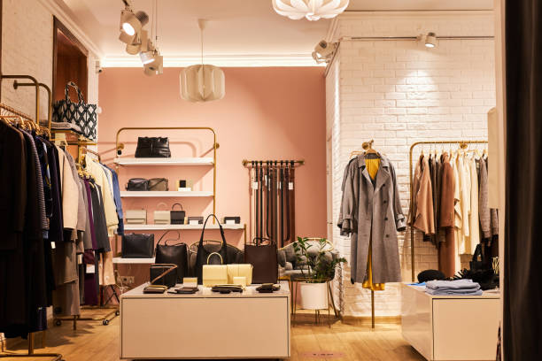 istock Clothing boutique with clothes and accessories on display 1572391955