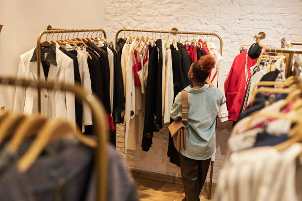 istock Black woman in boutque or second hand shop 1572392550