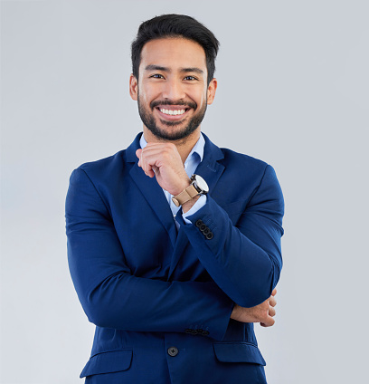 Business man, smile and style portrait in studio for corporate or CEO fashion while happy. Face of asian entrepreneur person on isolated white background with pride for luxury, success and wealth