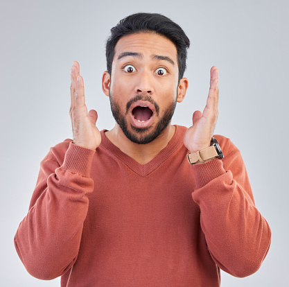 Surprise, shock face and portrait of man on white background with emoji, comic and facial expression. Wow mockup, omg and isolated male in studio with shocking information, news or announcement