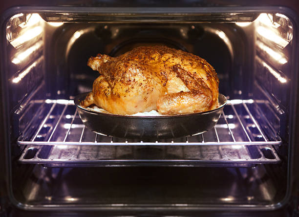 turkey is baked in oven stock photo