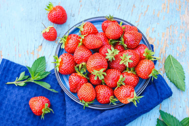 Free Stock Photo of Fresh strawberries on a red glass plate | Download ...