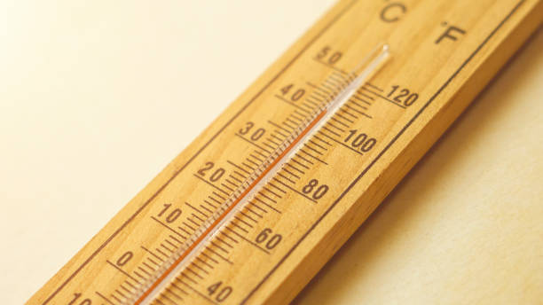 Global warming concept with a thermometer in the sun. stock photo