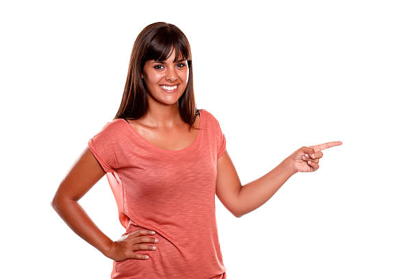 istock Stylish young woman looking at you pointing left 157245988