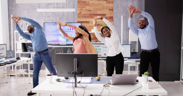 istock Corporate Yoga Exercise At Desk 1572461499