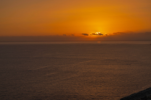 Beautiful view of orange sunset in Atlantic Ocean on island of Gran Canaria.