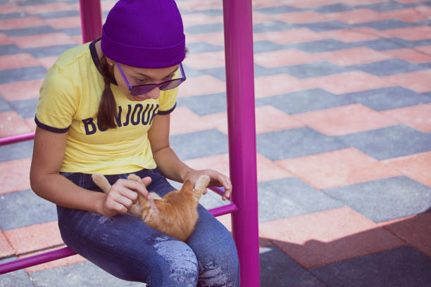 istock Girl and kitten 1572465831