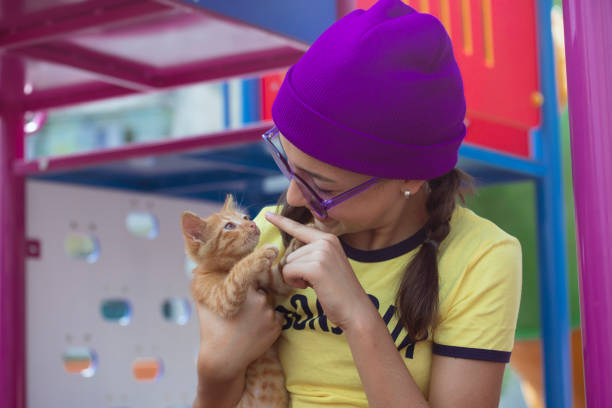 istock Girl and kitten 1572466372