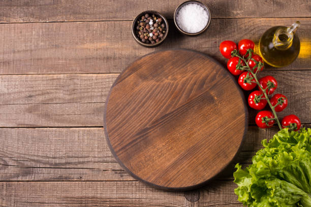 istock Wooden board food background. Ingredients for cooking on table. Banner. Layout. 1572481973