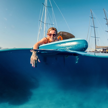 Woman paddling on a stand-up paddleboard