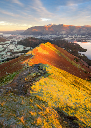 Beautiful Autumn colours on Lake District popular mountain; Catbells, overlooking Derwentwater and Skiddaw on a Winter morning.